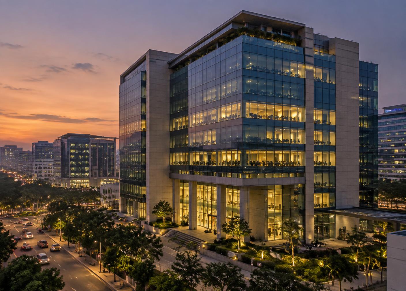Glass facade of a modern commercial office building at dusk